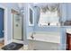 Bathroom showcasing a glass-door shower and a separate soaking tub beneath a window at 1674 Wakefield Way, Rock Hill, SC 29730