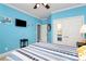 Bedroom with a blue color scheme, featuring white trim and a closet at 1674 Wakefield Way, Rock Hill, SC 29730