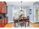 Charming dining room with natural light, hardwood floors, and classic wooden table at 1674 Wakefield Way, Rock Hill, SC 29730