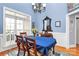 Formal dining room featuring hardwood floors, chandelier, and large windows creating the perfect spot for gatherings at 1674 Wakefield Way, Rock Hill, SC 29730