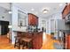 Charming kitchen with stainless steel appliances, granite countertops, hardwood floors, and breakfast bar seating at 1674 Wakefield Way, Rock Hill, SC 29730