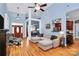 Open-concept living room with high ceilings, hardwood floors, large windows, and access to kitchen at 1674 Wakefield Way, Rock Hill, SC 29730
