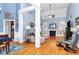 Bright living room with high vaulted ceilings, hardwood floors, fireplace, and an open floor plan at 1674 Wakefield Way, Rock Hill, SC 29730