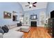 Comfortable living room with a fireplace, high ceilings, hardwood floors, and large windows with natural light at 1674 Wakefield Way, Rock Hill, SC 29730