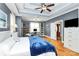 Comfortable main bedroom with tray ceilings, hardwood floors, and dresser at 1674 Wakefield Way, Rock Hill, SC 29730