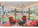 Relaxing screened porch featuring cozy seating, ceiling fan and serene views of the backyard at 1674 Wakefield Way, Rock Hill, SC 29730
