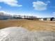 View of a sprawling backyard and stamped concrete patio, perfect for outdoor living at 174 Hanging Rock Trl # 104, Statesville, NC 28625