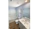 Bright bathroom featuring a shower-tub combination and a well-lit vanity at 174 Hanging Rock Trl # 104, Statesville, NC 28625