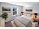 Comfortable bedroom with a queen bed, and complementary bedside tables and lamps at 174 Hanging Rock Trl # 104, Statesville, NC 28625