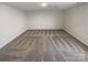 A roomy bedroom with plush carpeting and a neutral color palette at 174 Hanging Rock Trl # 104, Statesville, NC 28625