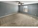 Generously sized bedroom with a ceiling fan and natural light at 174 Hanging Rock Trl # 104, Statesville, NC 28625