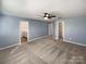 Large main bedroom showcasing en-suite bathroom and walk-in closet access at 174 Hanging Rock Trl # 104, Statesville, NC 28625