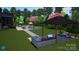 Expansive backyard with outdoor kitchen, grill, and a refreshing pool creating an ideal space for entertainment and leisure at 180 Twin Sisters Ln, Mooresville, NC 28117
