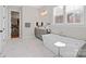 Elegant bathroom with a freestanding tub, window views, and sleek fixtures at 180 Twin Sisters Ln, Mooresville, NC 28117