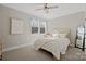 Well-lit bedroom with natural light, soft carpet, and modern decor at 180 Twin Sisters Ln, Mooresville, NC 28117
