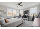 Relaxing bedroom features natural light from large windows and hardwood floors at 180 Twin Sisters Ln, Mooresville, NC 28117