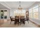 Elegant dining room with windows and access to the porch at 180 Twin Sisters Ln, Mooresville, NC 28117