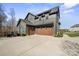 Side view of a modern two-car garage with concrete driveway at 180 Twin Sisters Ln, Mooresville, NC 28117