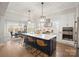 Modern kitchen with a large island, stainless steel appliances, and open dining area at 180 Twin Sisters Ln, Mooresville, NC 28117