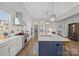 Bright kitchen features a large island, stainless steel appliances, and ample counter space at 180 Twin Sisters Ln, Mooresville, NC 28117