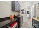 Functional laundry room with modern appliances, counter space, and custom cabinetry at 180 Twin Sisters Ln, Mooresville, NC 28117