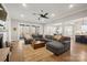 Spacious living room with fireplace and open layout to the dining room and kitchen at 180 Twin Sisters Ln, Mooresville, NC 28117