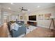 Spacious living room with ceiling fan, hardwood floors, and a decorative area rug at 180 Twin Sisters Ln, Mooresville, NC 28117