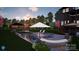 Beautifully landscaped backyard featuring a pool, spa, and outdoor lounging area, providing a tranquil escape at 180 Twin Sisters Ln, Mooresville, NC 28117