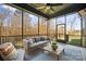 Screened porch with outdoor seating and peaceful views at 180 Twin Sisters Ln, Mooresville, NC 28117