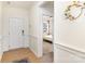 Bright foyer with hardwood floors and wainscoting, leading to a bedroom at 1854 Carrollton Dr, Indian Trail, NC 28079