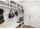Functional mudroom with built-in storage, bench seating, and convenient access to the entry door at 1854 Carrollton Dr, Indian Trail, NC 28079