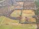 This aerial view showcases the expansive open land acreage, and the beautiful natural surroundings at 1A Riverlane Rd, Rock Hill, SC 29730