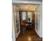Elegant dining room with hardwood floors, chandelier, and large windows at 203 S Washington St, Monroe, NC 28112