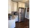 Kitchen with stainless steel refrigerator and granite counters at 203 S Washington St, Monroe, NC 28112