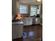Kitchen featuring granite countertops, stainless steel appliances, and brick backsplash at 203 S Washington St, Monroe, NC 28112
