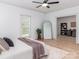 Bright bedroom features ceiling fan, hardwood floors, and adjacent office space at 207 Windsor Greene Dr, Monroe, NC 28110