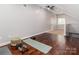 Spacious bonus room featuring hardwood floors, natural light and ceiling fan at 207 Windsor Greene Dr, Monroe, NC 28110