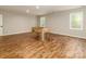 This game room features a foosball table and lots of light coming from the windows at 207 Windsor Greene Dr, Monroe, NC 28110