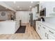 Modern kitchen with white cabinetry, stainless steel appliances, and a spacious island at 207 Windsor Greene Dr, Monroe, NC 28110