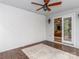 Covered porch with gray vinyl siding, concrete floor, brick wall, and interior access at 207 Windsor Greene Dr, Monroe, NC 28110