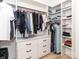 This walk-in closet features ample clothing racks and a built-in dresser at 207 Windsor Greene Dr, Monroe, NC 28110