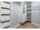 Spacious closet with shelves, drawers, and wooden floors at 2243 Creek View Ct, Indian Land, SC 29707