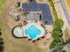 Aerial view of the community pool with a playground and seating area at 2243 Creek View Ct, Indian Land, SC 29707