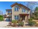 Beautifully landscaped two-story home with a charming front porch at 2243 Creek View Ct, Indian Land, SC 29707
