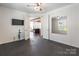 Spacious flex room with dark flooring, a ceiling fan, and easy access to the kitchen at 2243 Creek View Ct, Indian Land, SC 29707