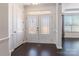 Bright foyer with double glass doors and hardwood floors at 2243 Creek View Ct, Indian Land, SC 29707