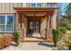 Inviting front porch with stone accents and a double-door entrance at 2243 Creek View Ct, Indian Land, SC 29707