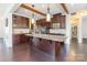 Gourmet kitchen featuring custom wood cabinets, granite countertops, and a spacious center island at 2243 Creek View Ct, Indian Land, SC 29707