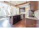 Gourmet kitchen with custom wood cabinets, large center island, and stainless steel appliances at 2243 Creek View Ct, Indian Land, SC 29707