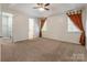 Large main bedroom with trey ceiling, a ceiling fan, and two large windows at 2243 Creek View Ct, Indian Land, SC 29707